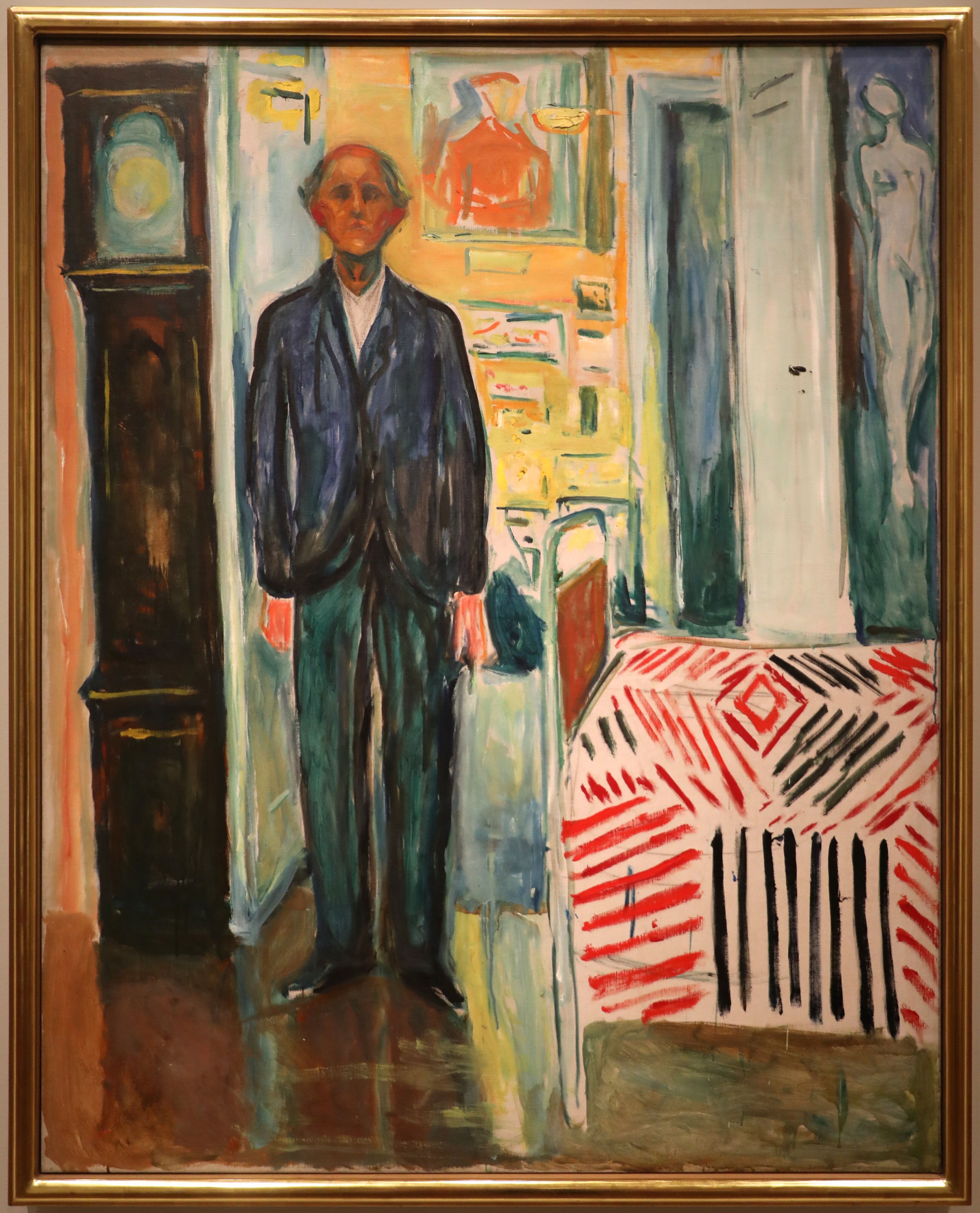 Selbstbildnis zwischen Uhr und Bett · Edvard Munch, 1940–1943